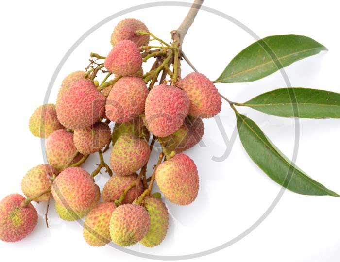 bunch the red ripe lychee with green leaves isolated on white background.