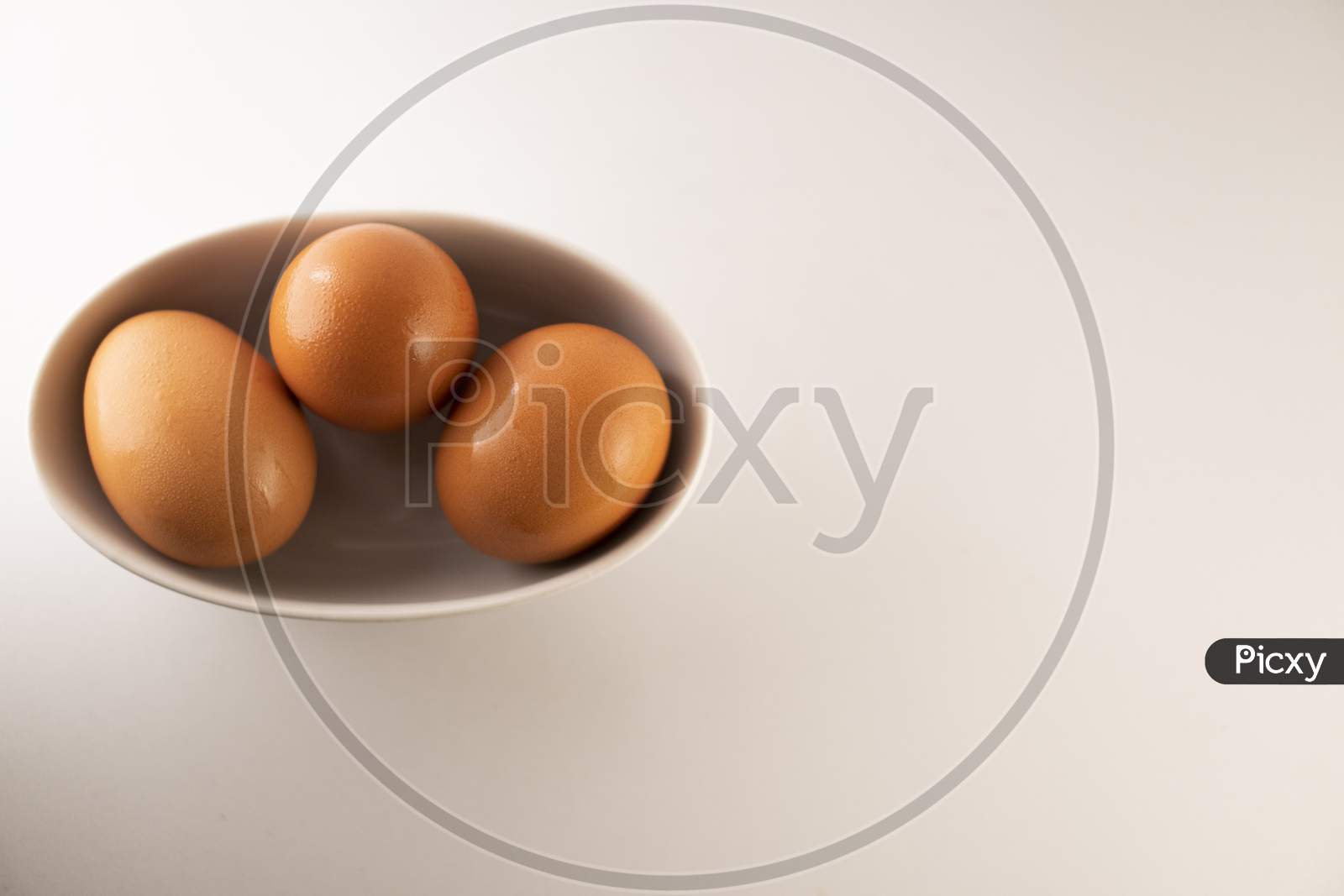eggs in a bowl on a white background.