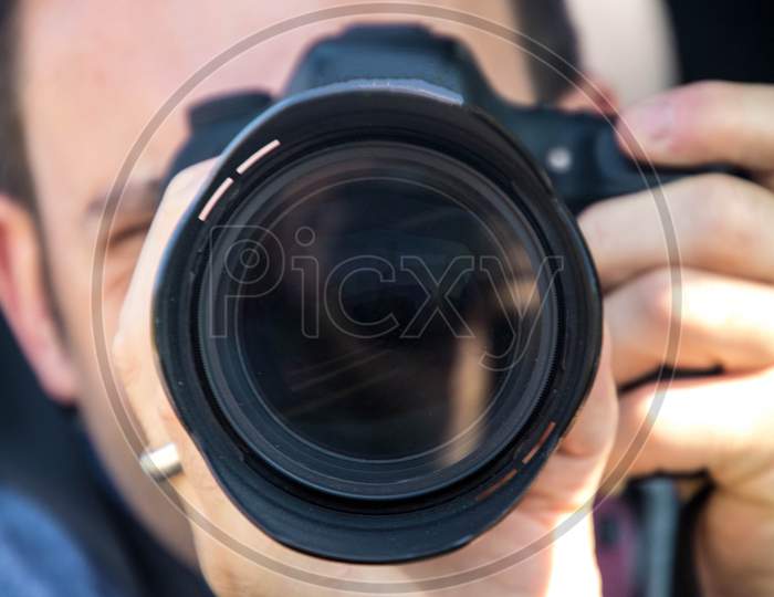 Photographer Through The Lens