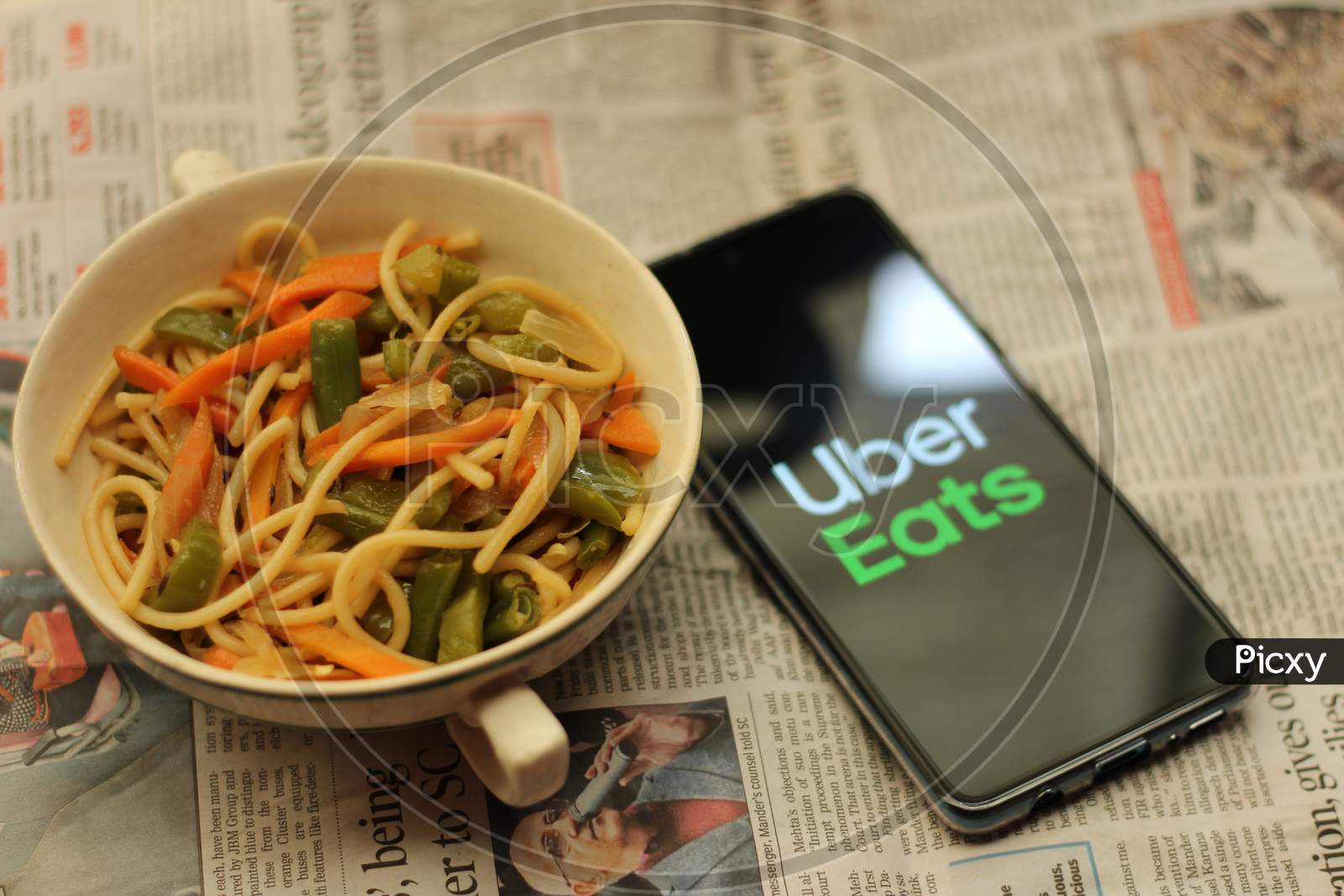 Uber eats application icon on smartphone.