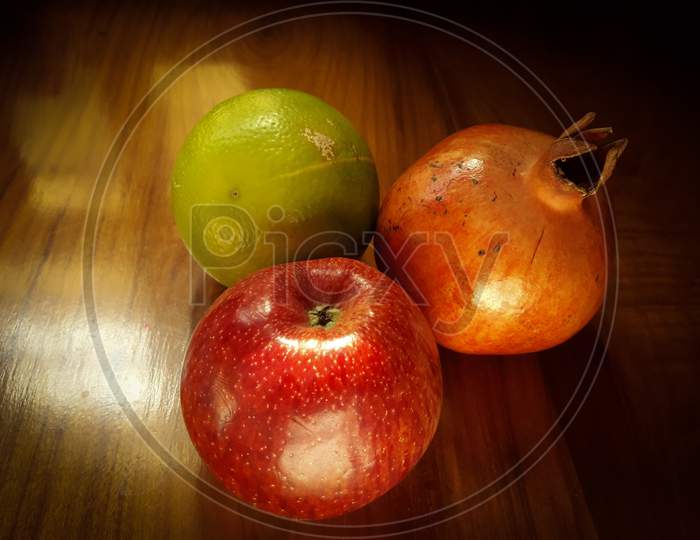 Fruits in a basket citrus pomegranate apple vibrant in colour