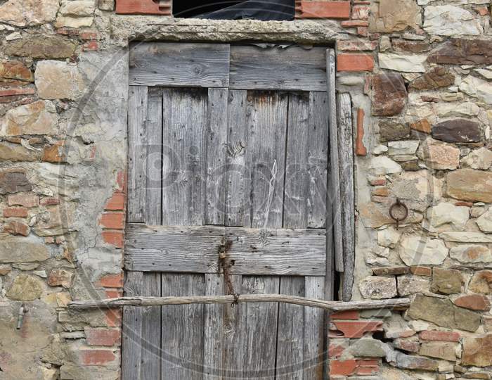 The medieval style wooden door in Tuscany Italy