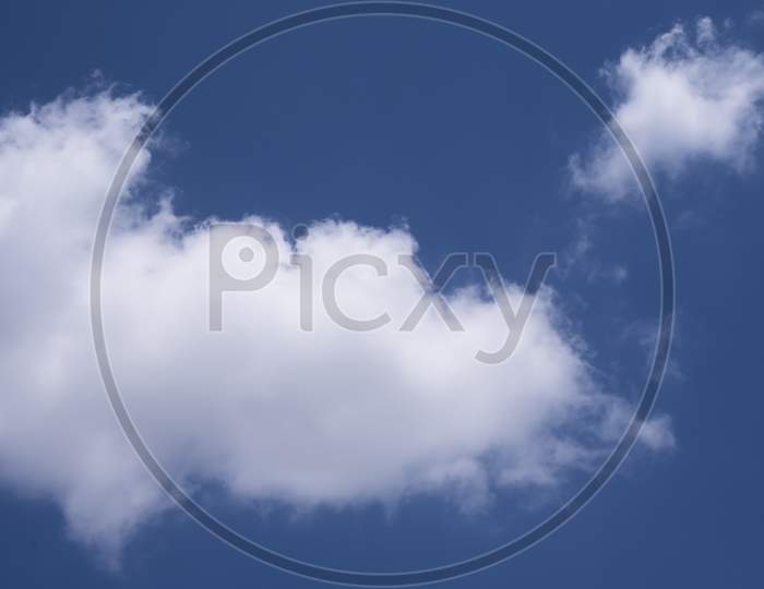 Beautiful View Of A Blue Sky With Fluffy Clouds
