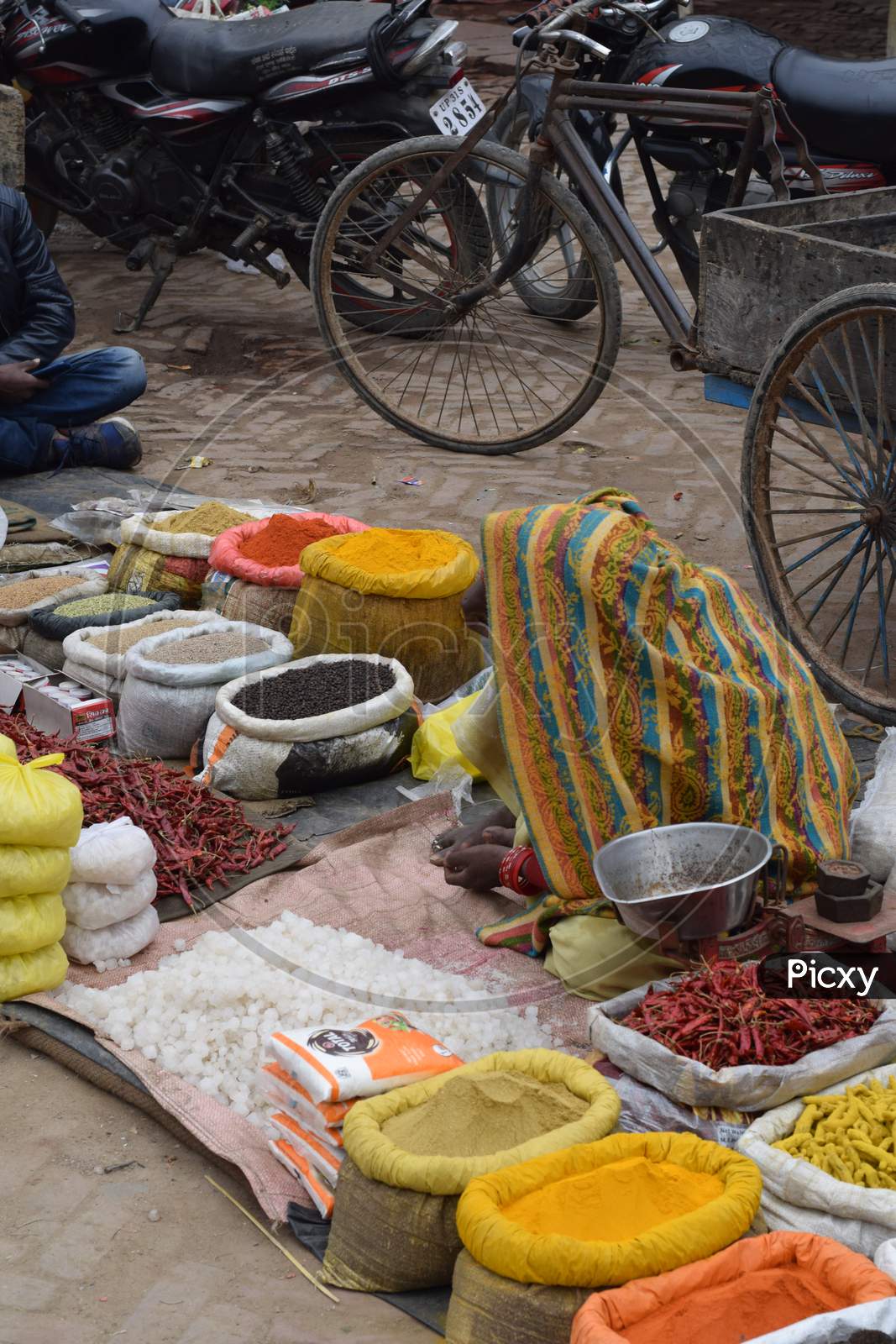 Woman selling spices at market