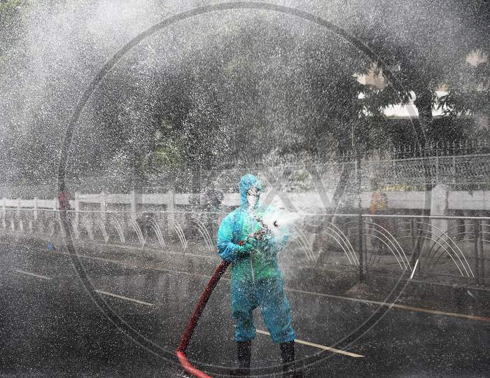 A Firefighter Sprays Disinfectant As A Preventive Measure Against The Spread Of The Covid-19 Coronavirus In A Containment Zone In Chennai