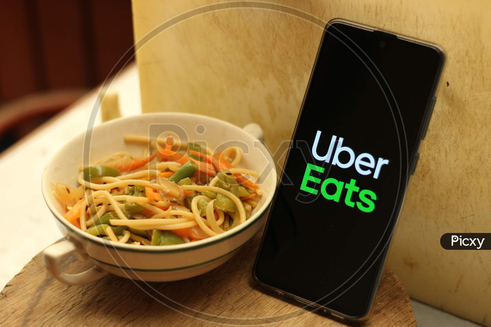 Uber eats application icon on smartphone.