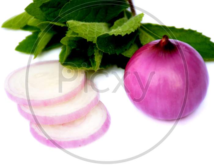 the sliced onion with green mint isolated on white background.