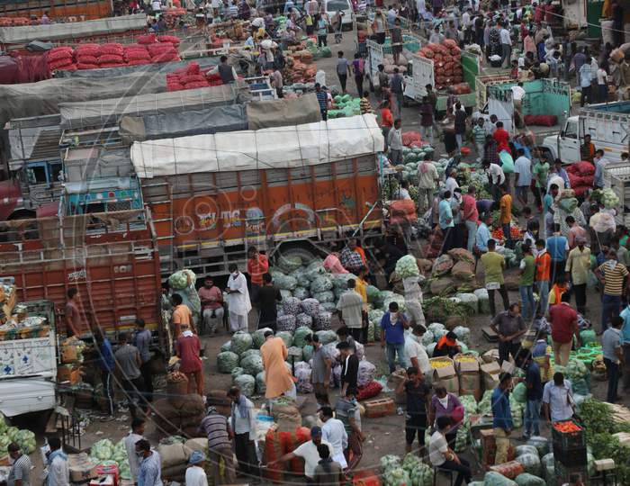 A view of people at a wholesale vegetable market seen defying social distancing guidelines, during Unlock 2.0, in Jammu