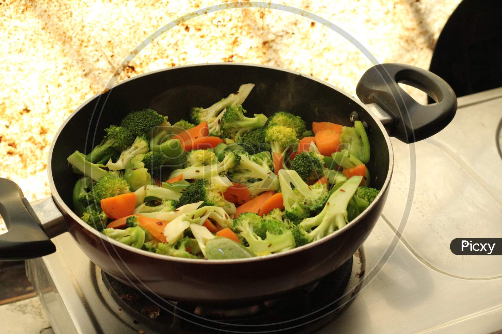 Cooking Half cooked vegetables on black fry pan