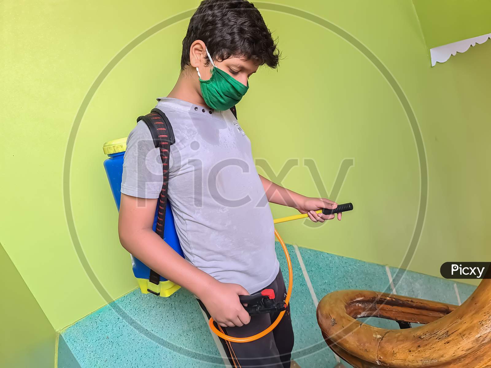 A boy with sanitizer