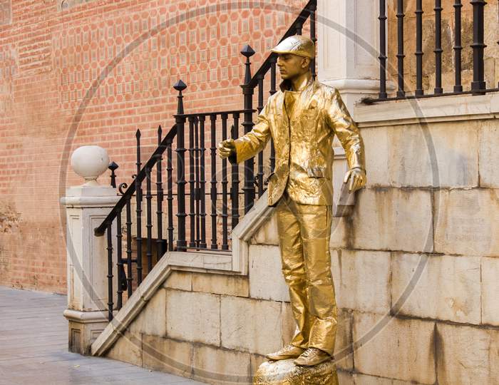 Malaga, Spain - September 03, 2015: Street Performer Suits Up Entirely Gold In The Streets Of Malaga Main City Center