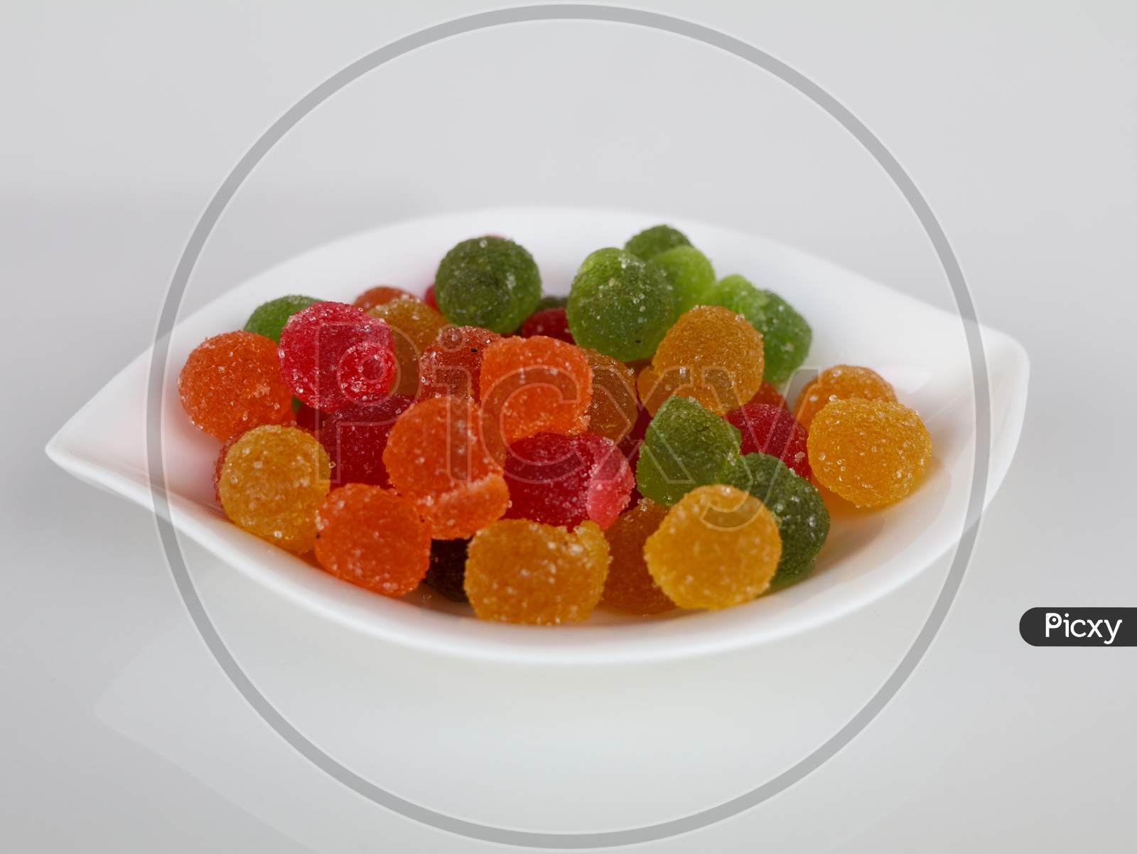 Sweet Mixed Color Jelly Candy In A White Bowl Against White Background