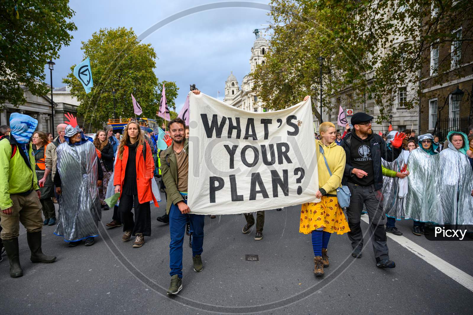 Climate Change Protesters Carrying A Protest Banner At An Extinction Rebellion Protest March