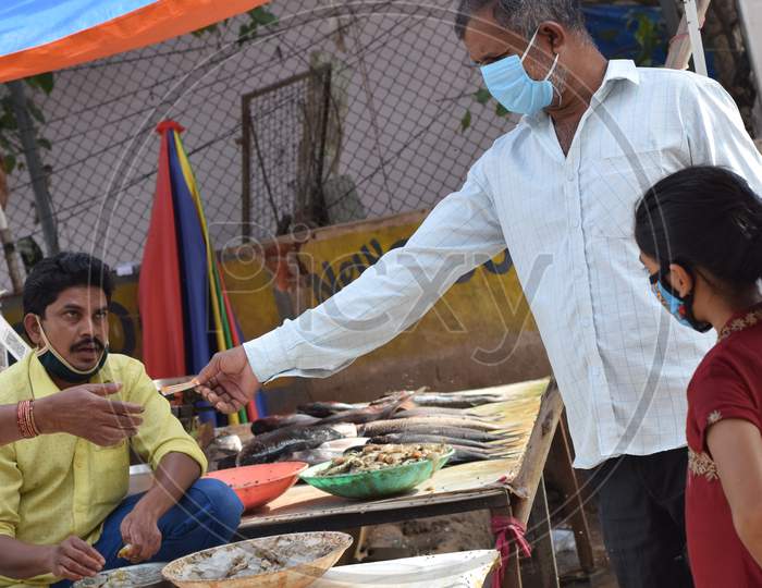 Hyderabad, Telangana, India. July-20-2020: Peoples Wearing At Fish Market, Customer Buying Fish While Wearing Protective Mask, Corona Pandemic Concept