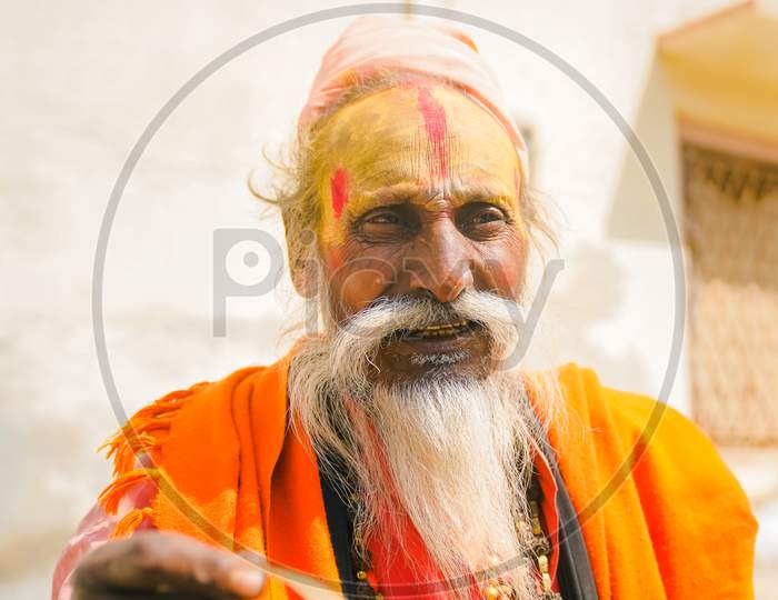 siwana,rajisthan-25february 2020:indian aged portrait of a man asking for food outside from the car