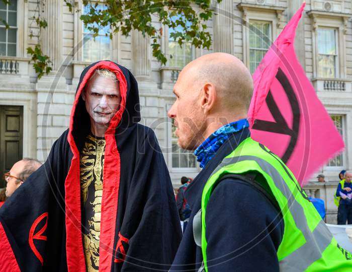 An Extinction Rebellion Protester In Costume