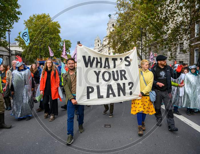 Climate Change Protesters Carrying A Protest Banner At An Extinction Rebellion Protest March