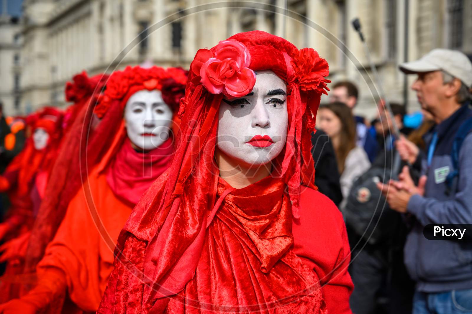 Close Up Of Red Brigade Protesters At An Extinction Rebellion Protest March