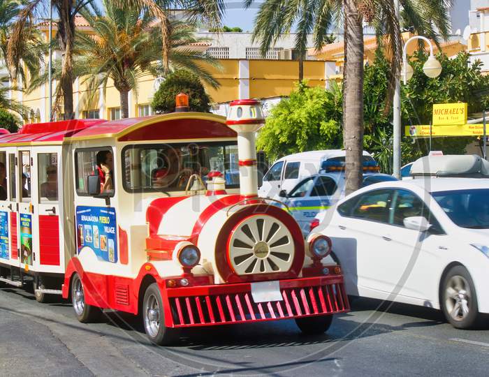 Costa Del Sol, Spain - September 02, 2015: A Toy Train On A Road Carrying Tourists In A Region Of Andalusia