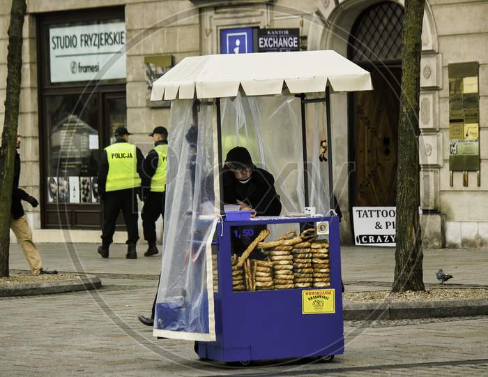 Krakow, Poland - December 16, 2014: A Bread Seller Man Waiting For Customers In His Outlet On A Street