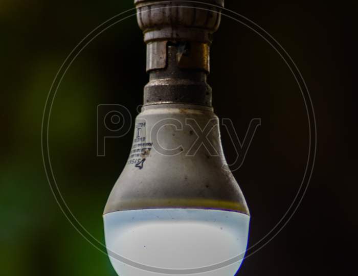 A glowing white light bulb