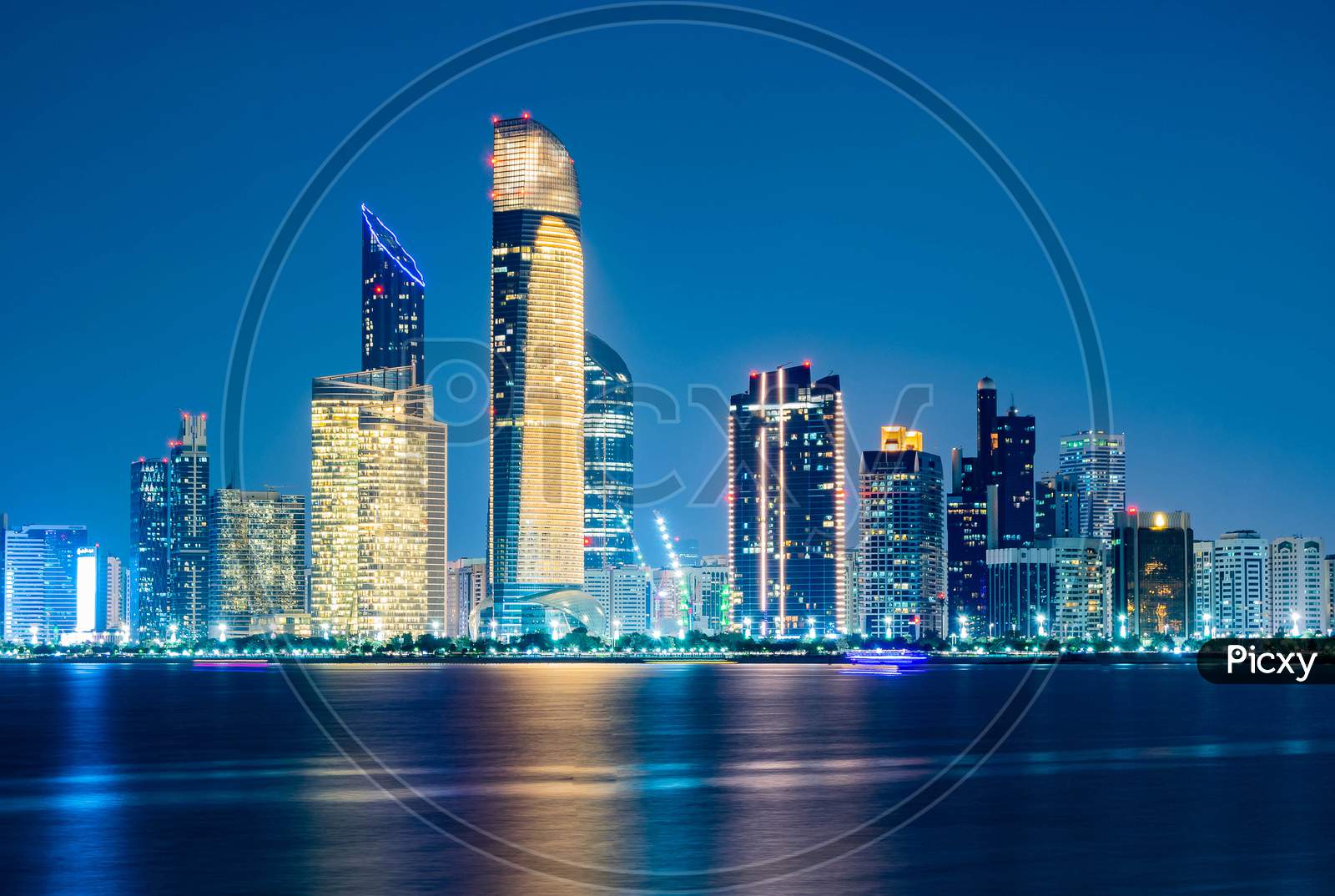 Beautiful City Night View Of Abu Dhabi Financial And Commercial District, Taken During Blue Hour, View From Marina Backwater, United Arab Emirates, Luxury Life Style, Business In Uae,