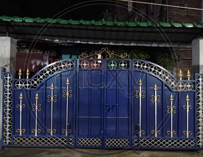 A blue designer iron gate