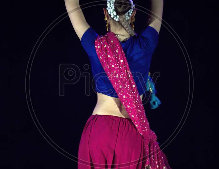 Krakow, Poland - March 22, 2015: A Female Dressed Up Indian Traditional Cloths Performing Classical Dance On Stage