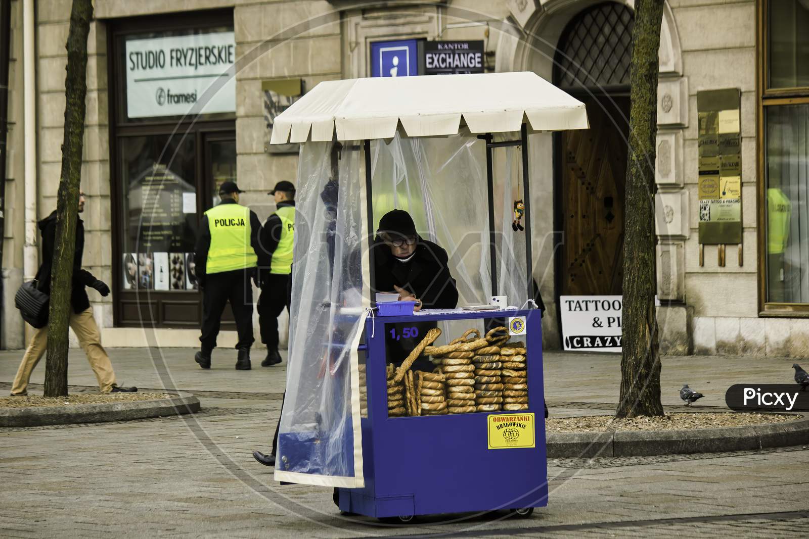 Krakow, Poland - December 16, 2014: A Bread Seller Man Waiting For Customers In His Outlet On A Street