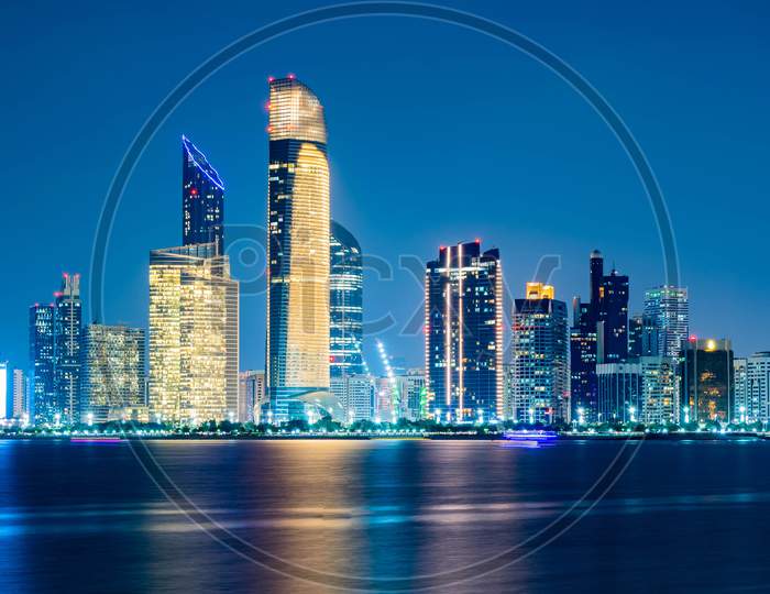 Beautiful City Night View Of Abu Dhabi Financial And Commercial District, Taken During Blue Hour, View From Marina Backwater, United Arab Emirates, Luxury Life Style, Business In Uae,