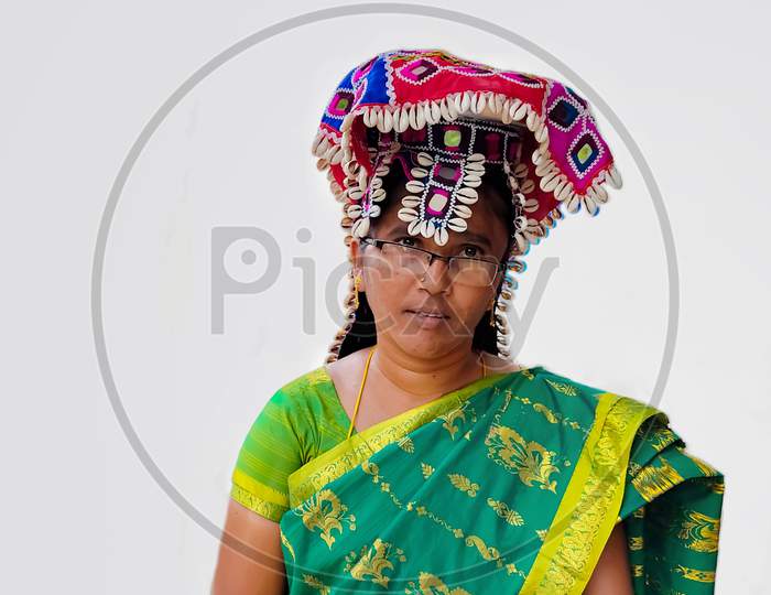 Portrait of an Indian woman at Chaksu Fair in Jaipur with white background.