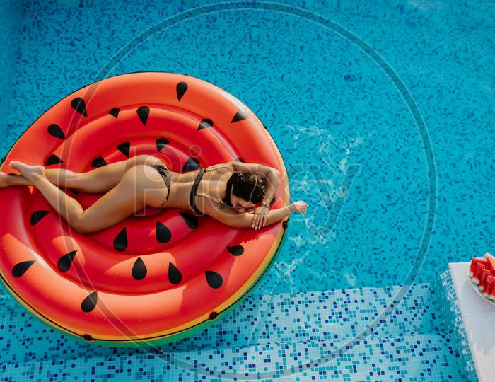Pool Float Woman Relaxing In Swimming Pool On Summer Vacations
