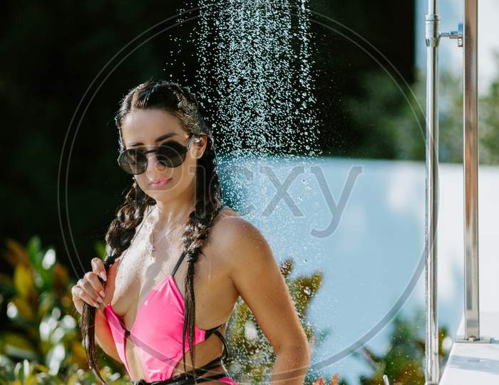 Sexy Female Model Taking Shower Outdoors At Hot Summer Day