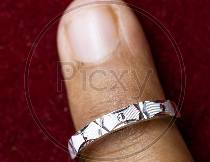 Wearing A Round Silver Ring