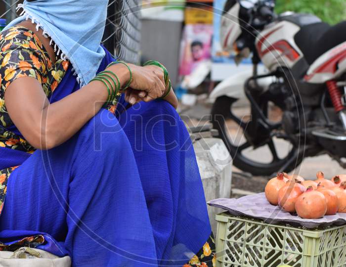 Hyderabad, Telangana, India. July-20-2020: Woman, Fruits Trader Was Wearing Mask In Her Work, Women Selling Fruits At Road Side, Small Business, Corona Pandemic Time