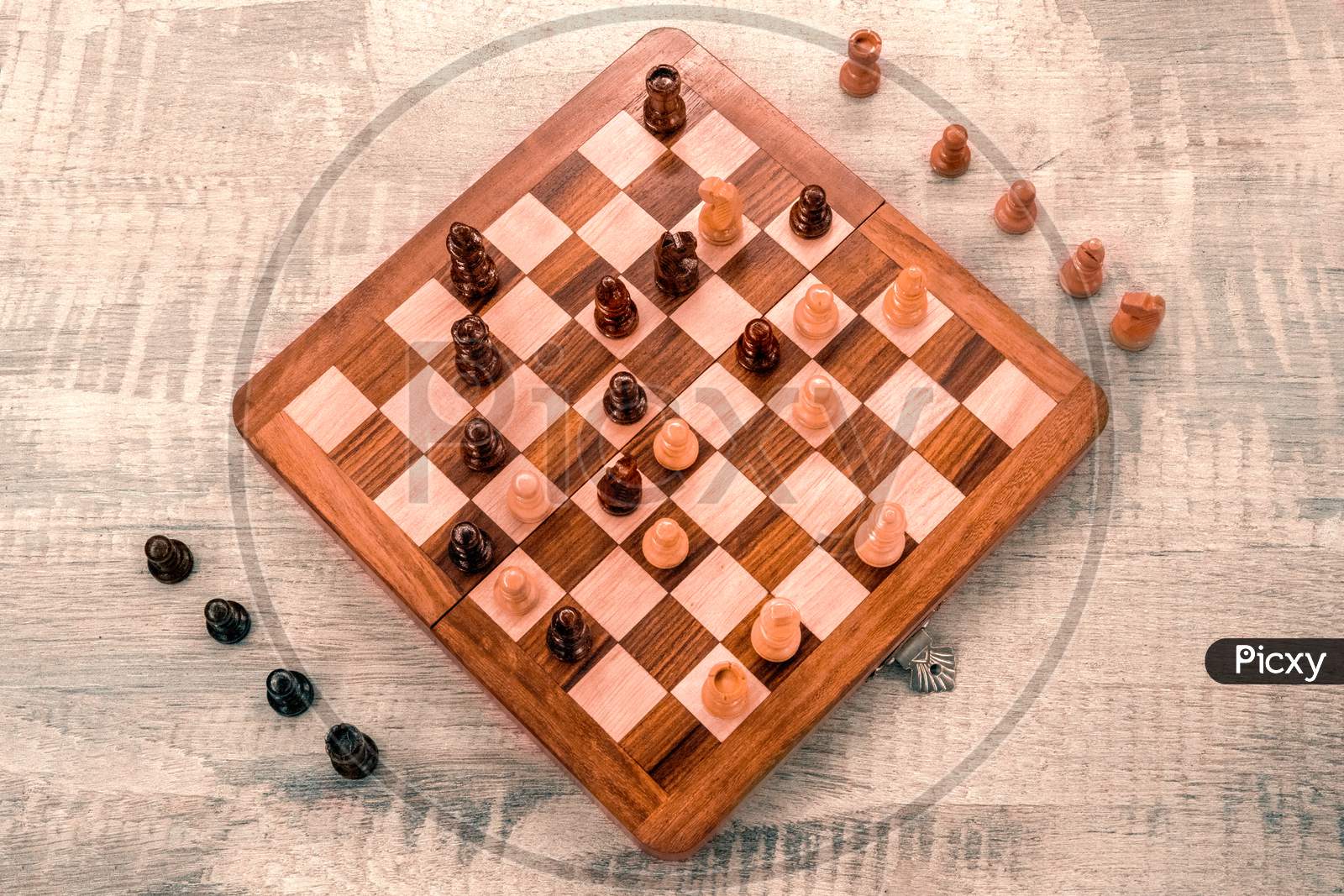 Wooden chess board with pieces top view