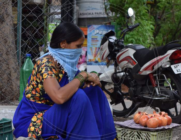 Hyderabad, Telangana, India. July-20-2020: Woman, Fruits Trader Was Wearing Mask In Her Work, Women Selling Fruits At Road Side, Small Business, Corona Pandemic Time