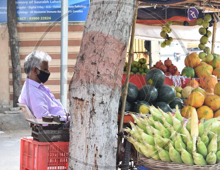 Hyderabad, Telangana, India. July-20-2020: Old Aged Fruits Trader Selling Fruits While Wearing Face Mask, Senior