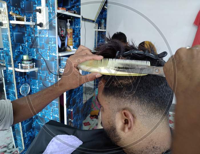 Barber cutting hair