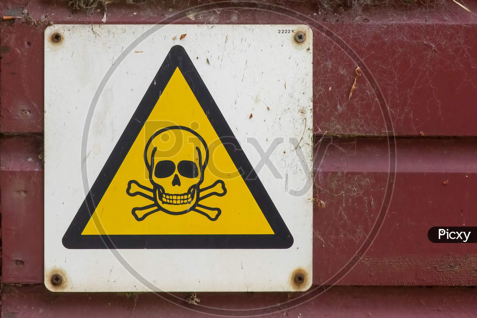 Dangerous hazard yellow warning sign on workshop door