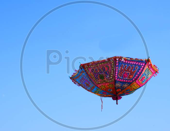 Umbrella hanging in the sky, colorful umbrella