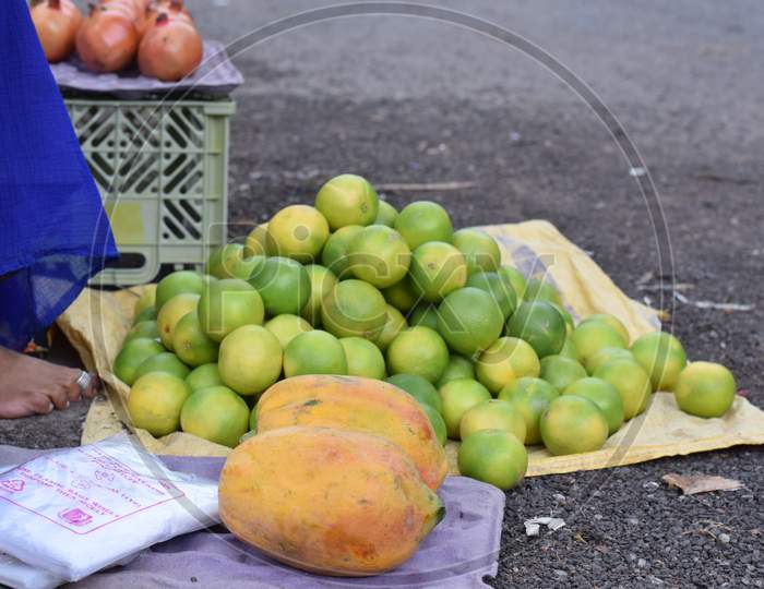 women selling fruits at road side, small business