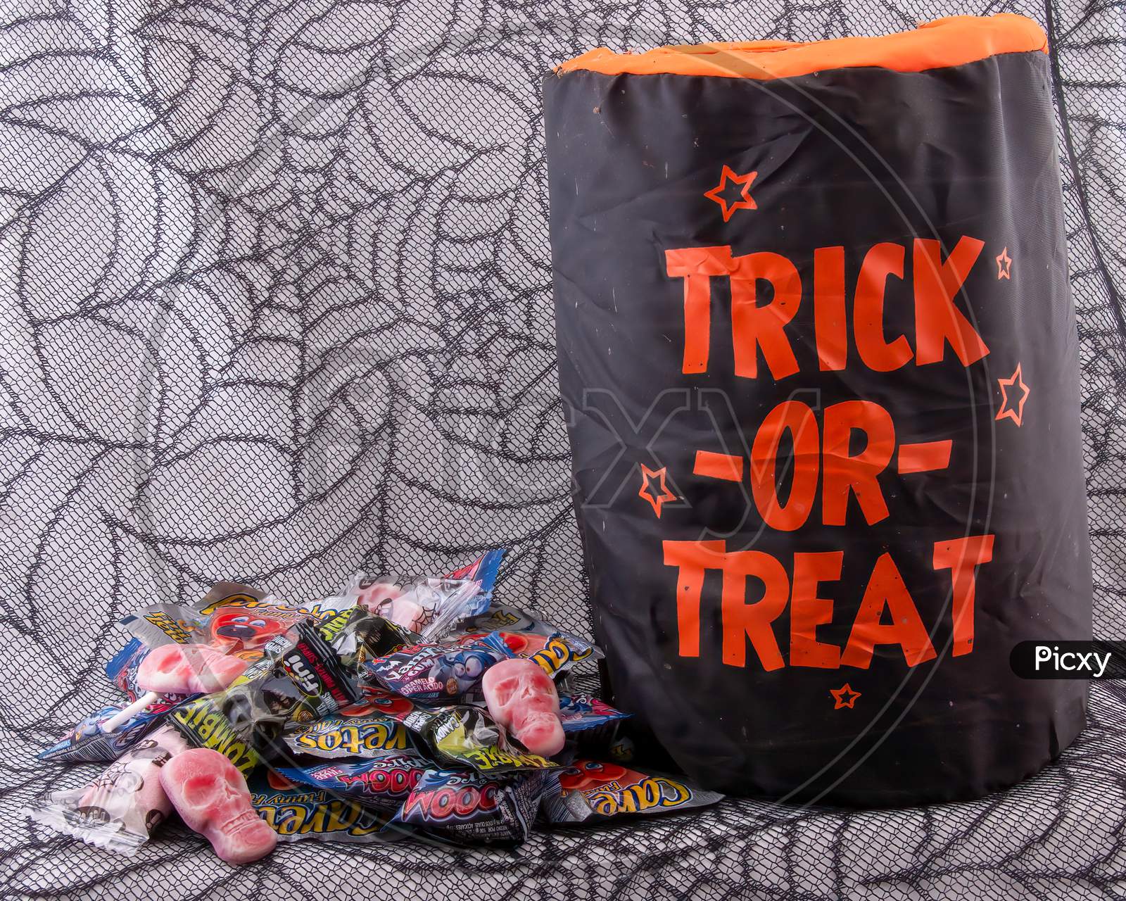 Trick Or Treat Candy On A Spider Web Background