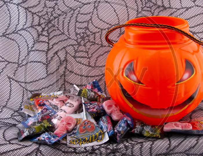 Trick Or Treat Candy on a spider web background