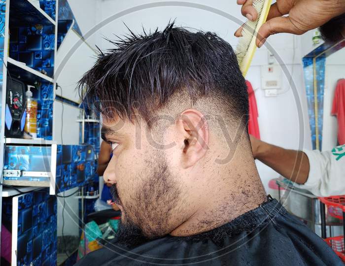 Cutting hair in Berber shop.