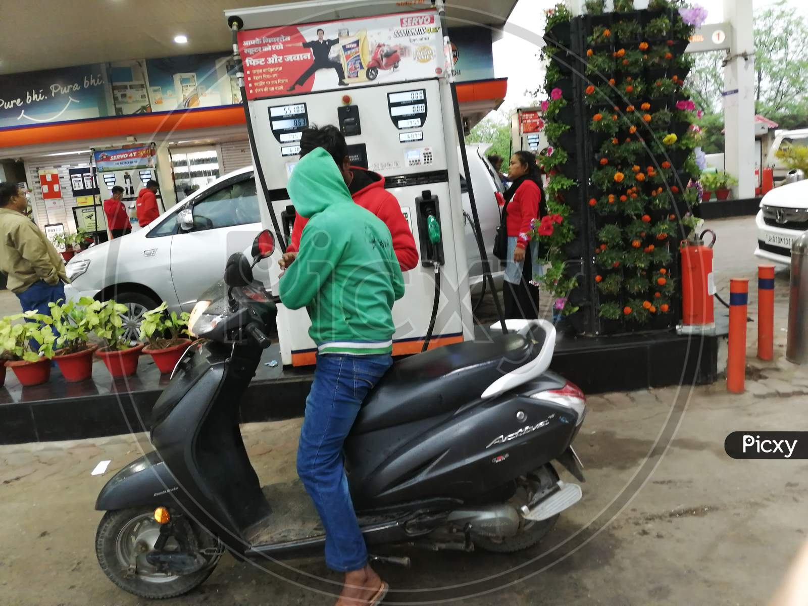 A man taking petrol from petrol station