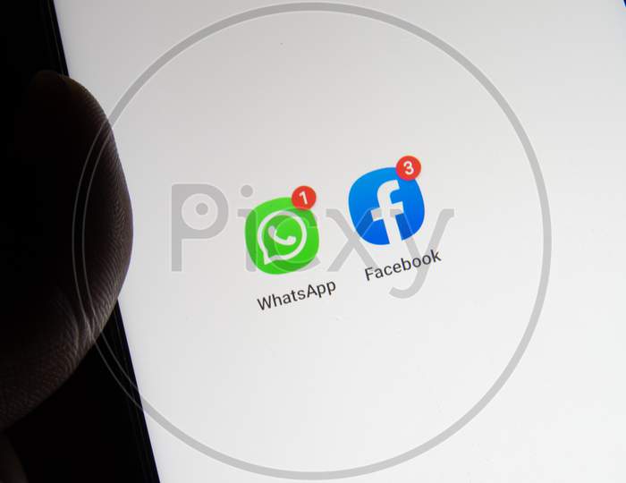 Whatsapp And Facebook Icon In Mobile Phone Together.