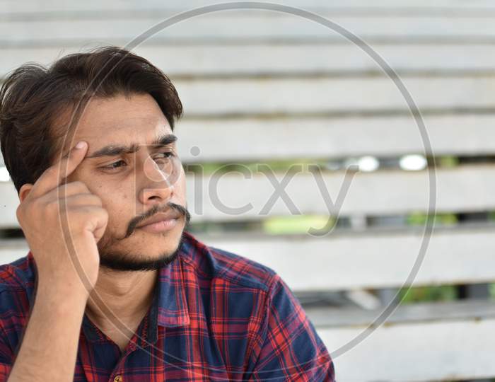 indian college student in deep  thinking position