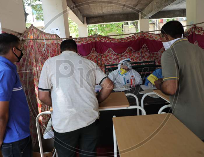 Paramilitary soldiers wait for covid test outside an isolation ward of Government medical collage where coronavirus affected patients are treated in Jammu on Thursday.23 JULY 2020,