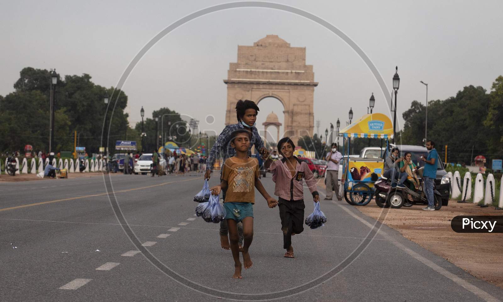 Children Run To Sell Indian Blue Berries At India Gate, Rajpath, On  July 22, 2020 In New Delhi, India.